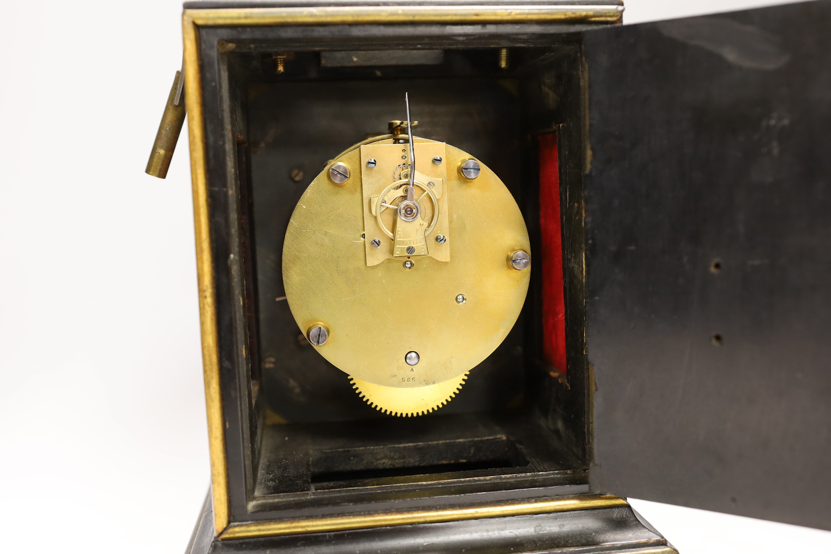 A mantel timepiece with balance escapement, silvered dial and ebonised case, 24cm